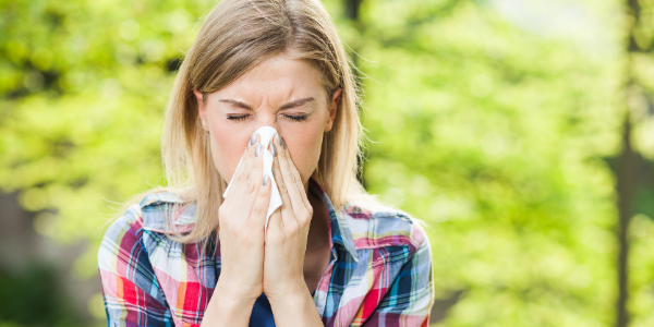 Spring Allergies – Green Group image of woman sneezing
