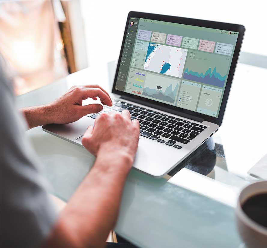 Closeup shot of someone's hands typing on a laptop keyboard